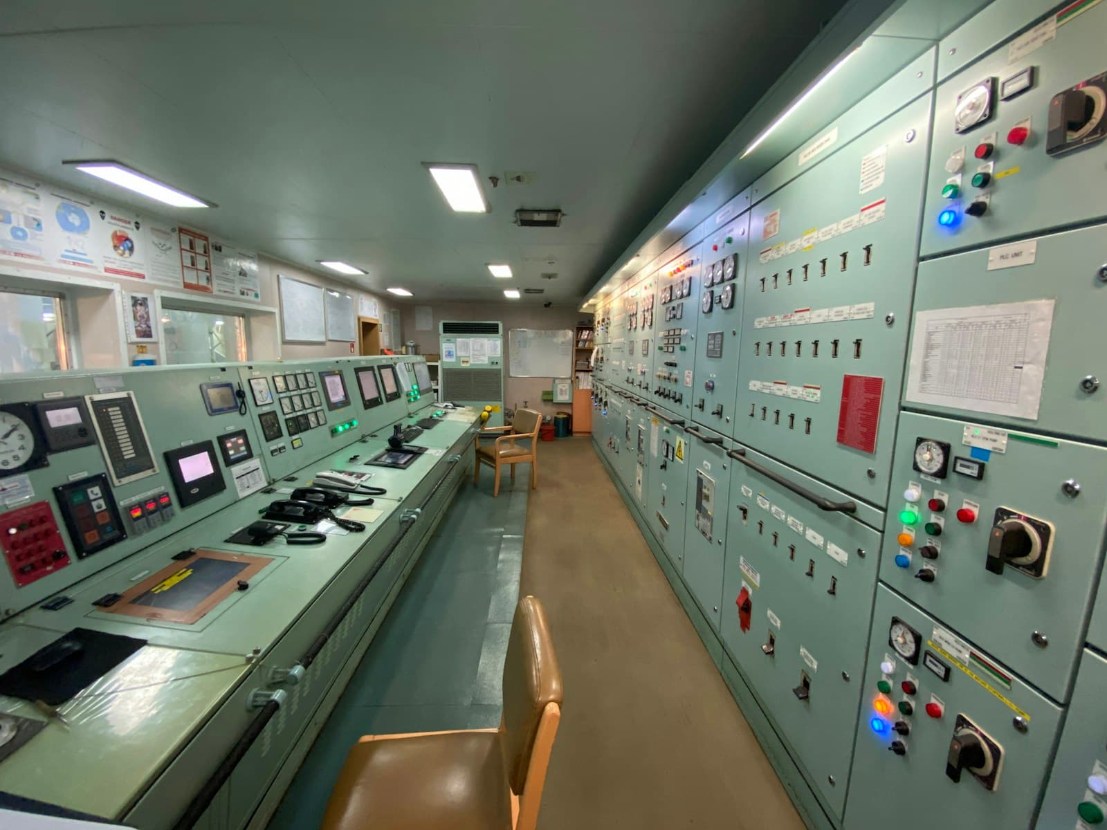 Ship control room with navigation and automation equipment aboard a vessel.